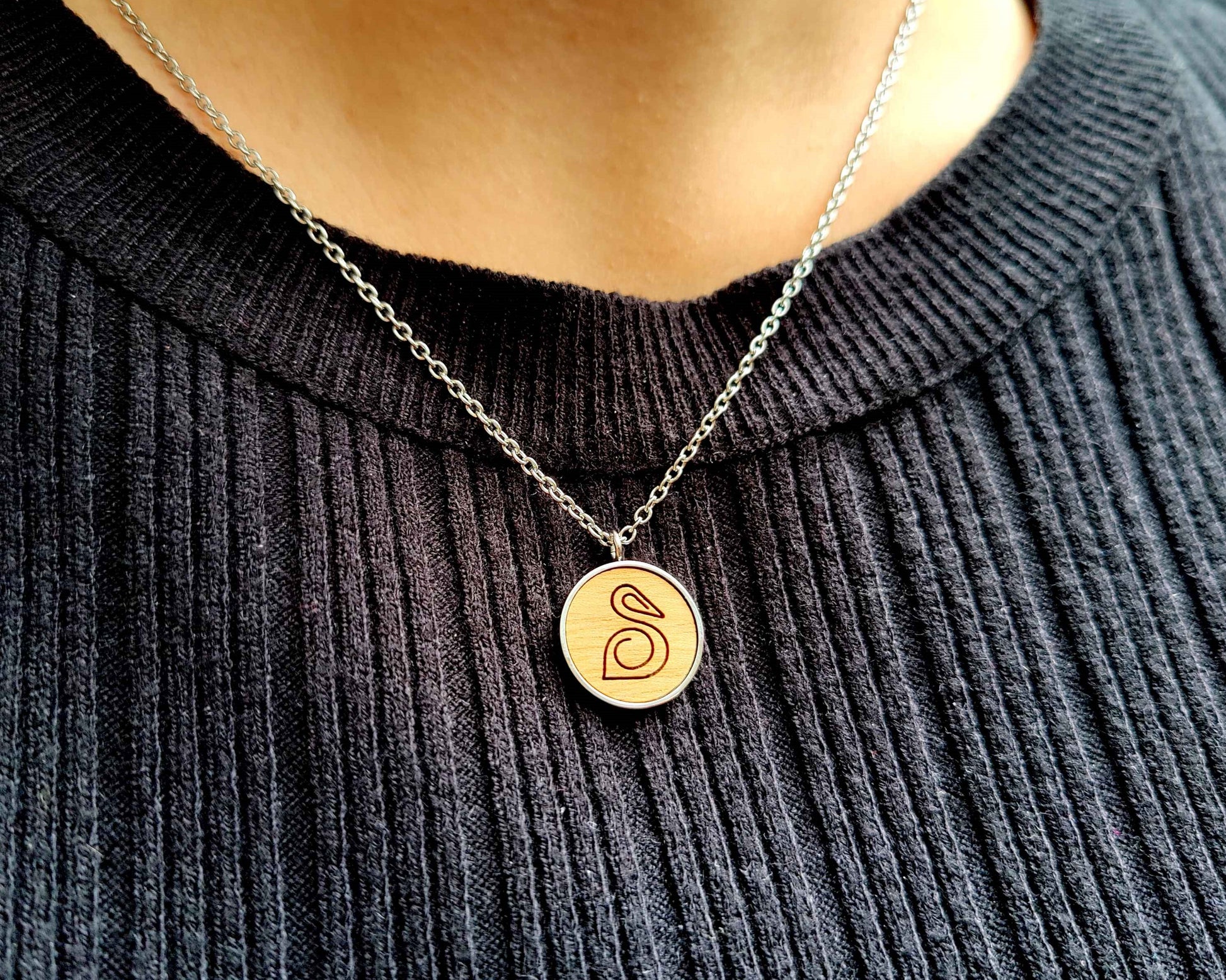 Nut wood pelican pendant necklace with stainless steel chain.  All our eco-friendly necklaces are delivered in FSC certified jewelry boxes with sustainable foam.