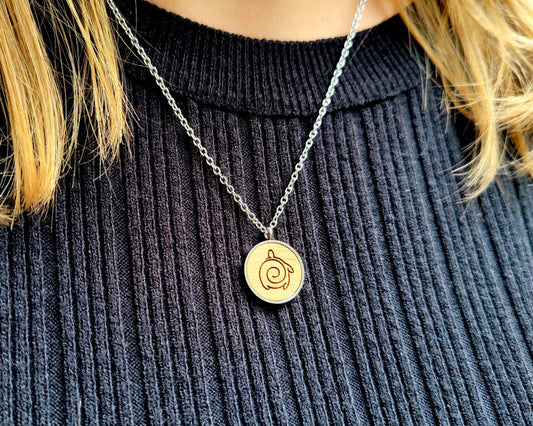 Nut wood turtle pendant necklace with stainless steel chain.  All our eco-friendly necklaces are delivered in FSC certified jewelry boxes with sustainable foam.