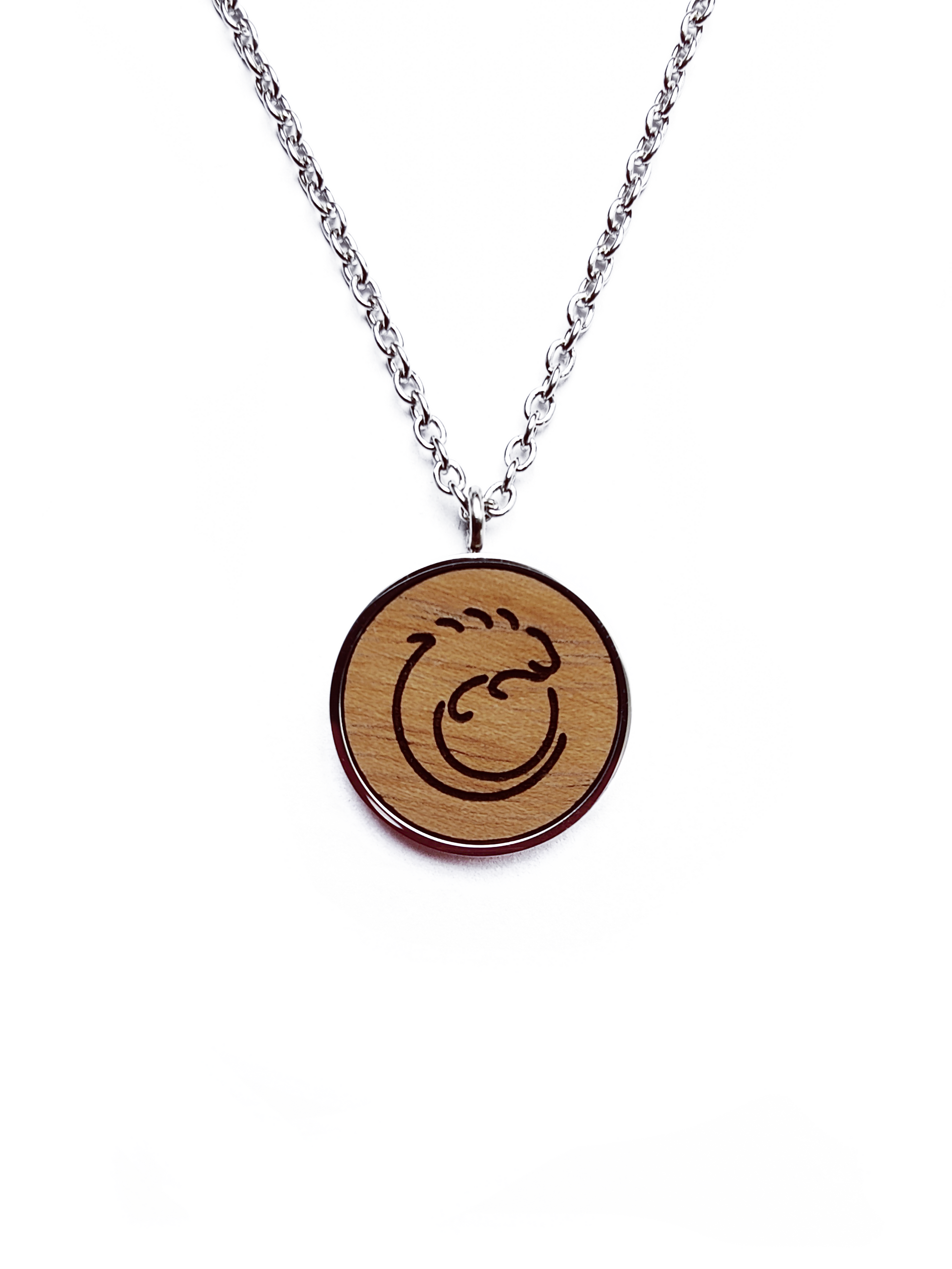 Nut wood iguana pendant necklace with stainless steel chain. All our eco-friendly necklaces are delivered in FSC certified jewelry boxes with sustainable foam.