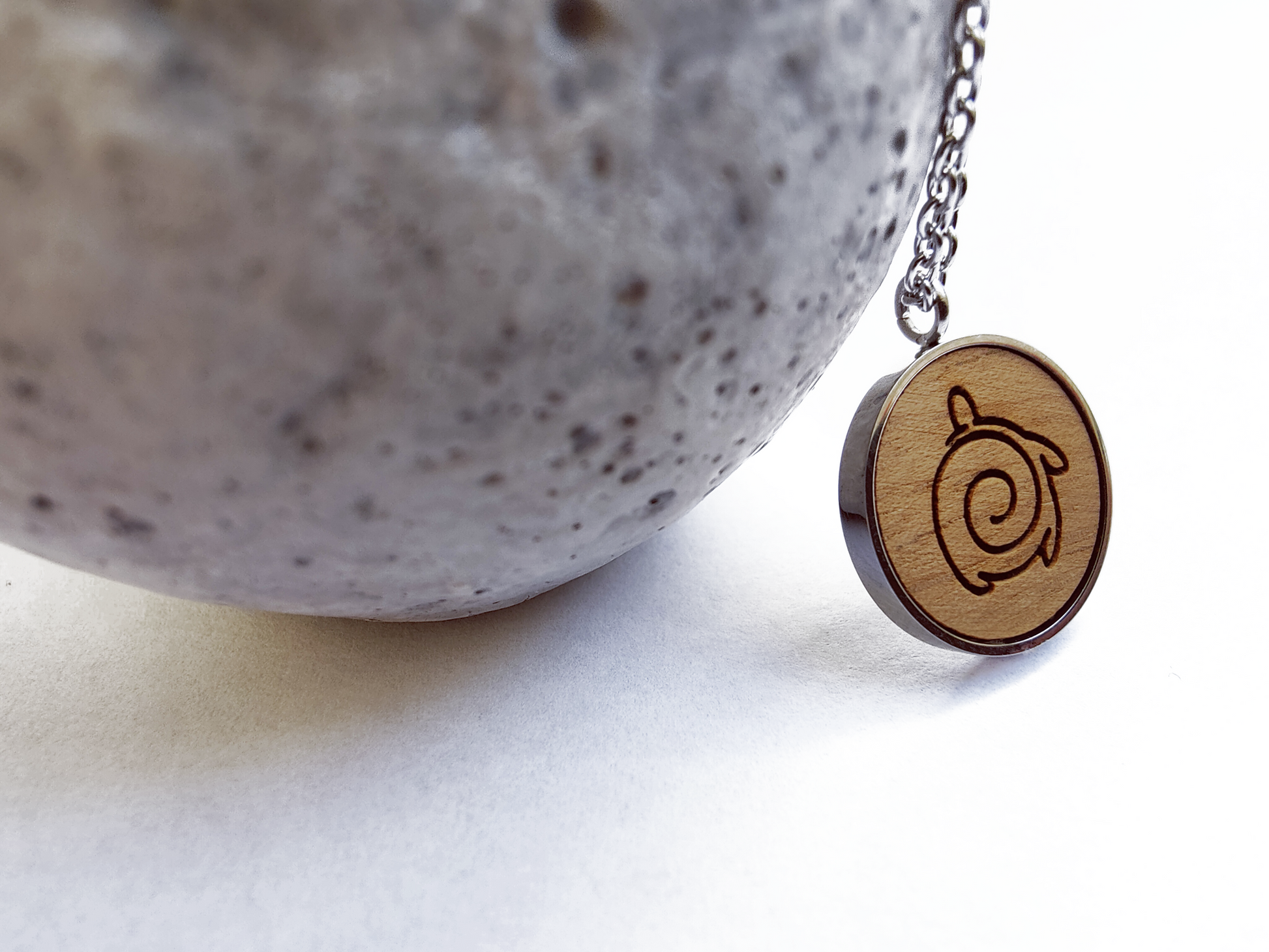 Nut wood turtle pendant necklace with stainless steel chain. All our eco-friendly necklaces are delivered in FSC certified jewelry boxes with sustainable foam.
