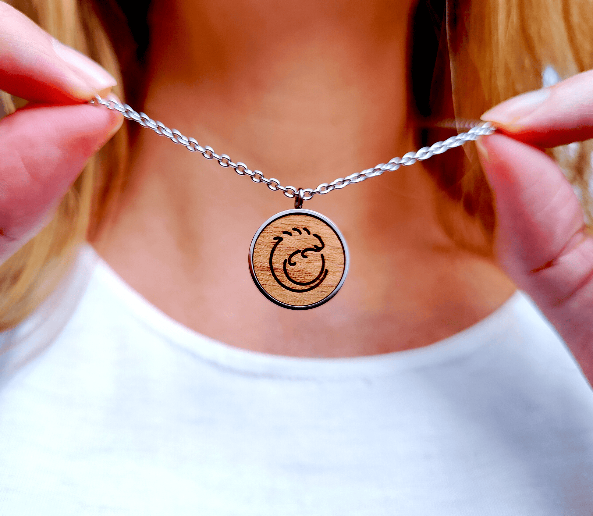 Nut wood iguana pendant necklace with stainless steel chain.  All our eco-friendly necklaces are delivered in FSC certified jewelry boxes with sustainable foam.