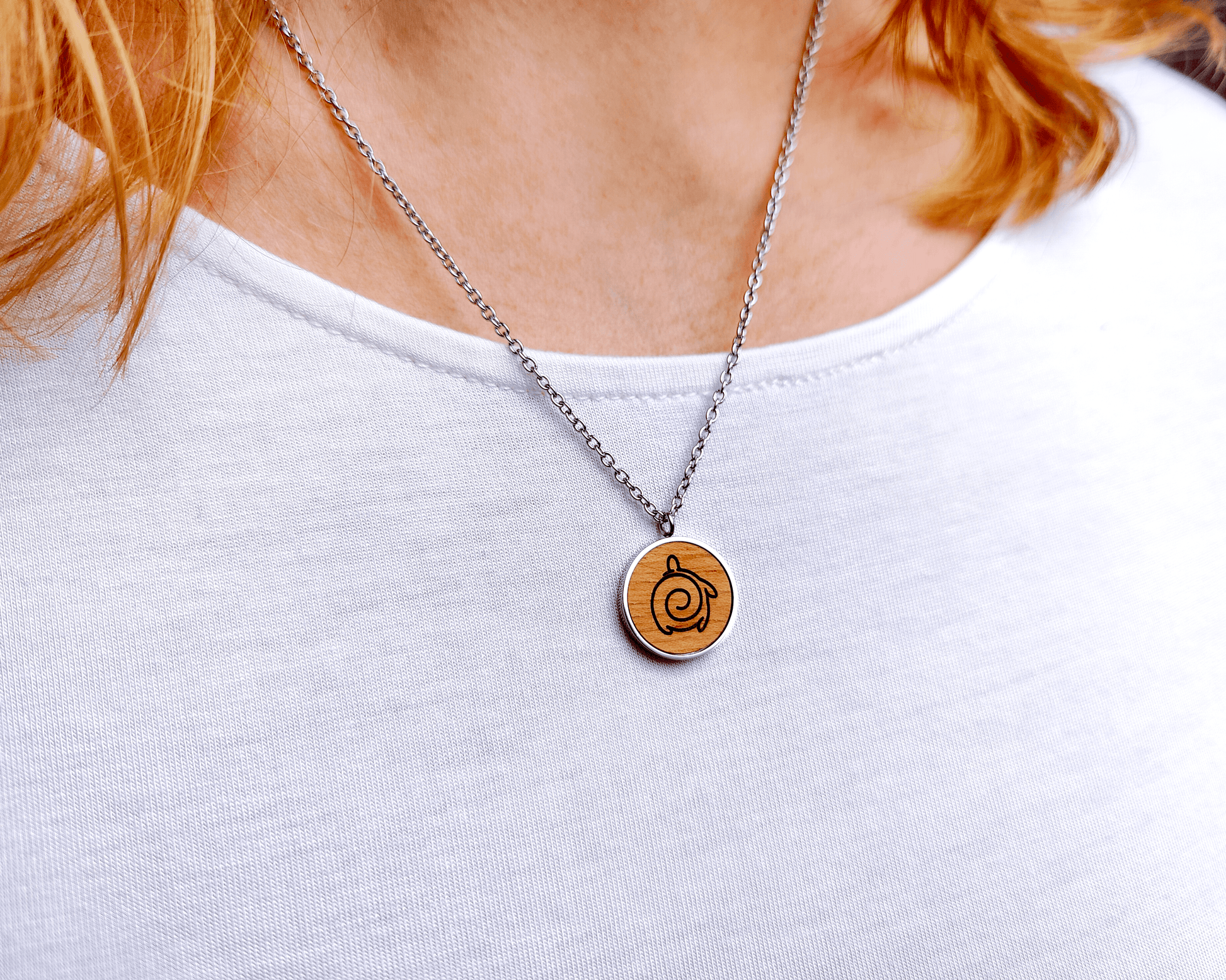 Nut wood turtle pendant necklace with stainless steel chain. All our eco-friendly necklaces are delivered in FSC certified jewelry boxes with sustainable foam.